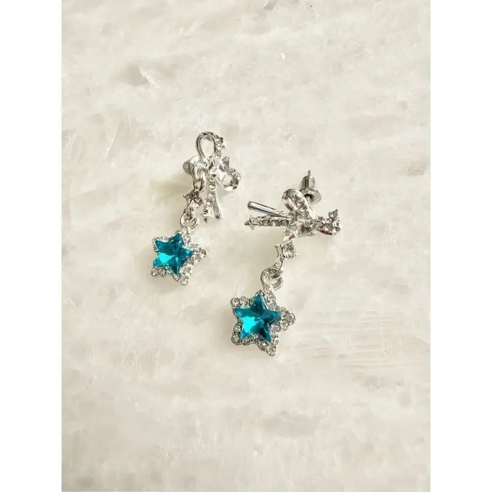 Bright blue star dangle earrings